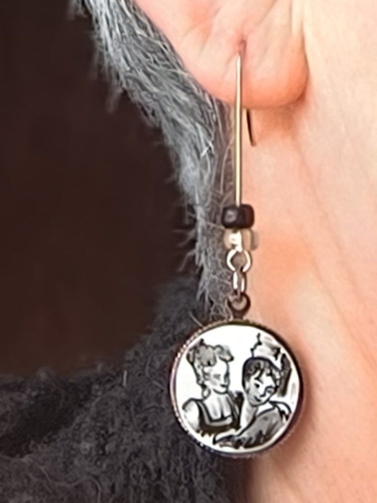 Boucle d'oreille noire et blanche portée 